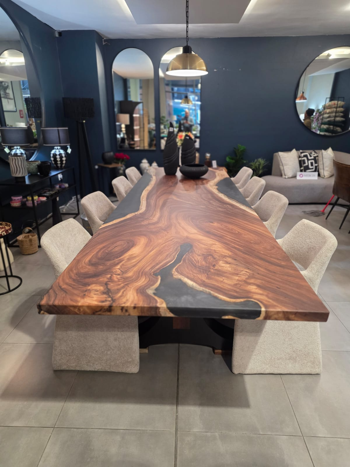 Twelve-seat boardroom slab with a charcoal river through figured hardwood