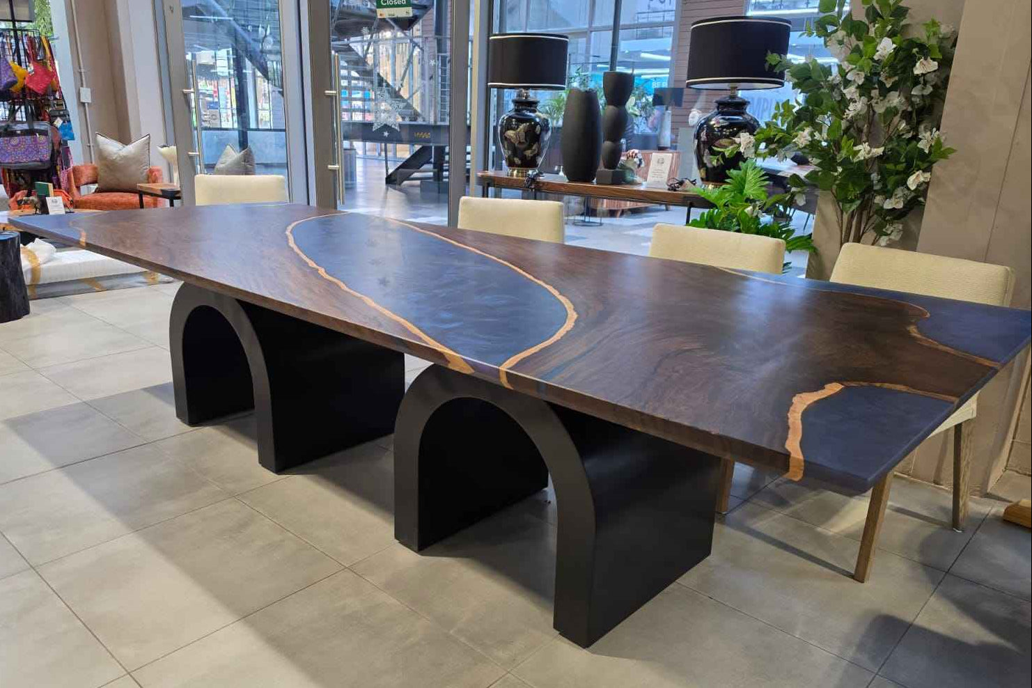 Leadwood table with arched metal legs