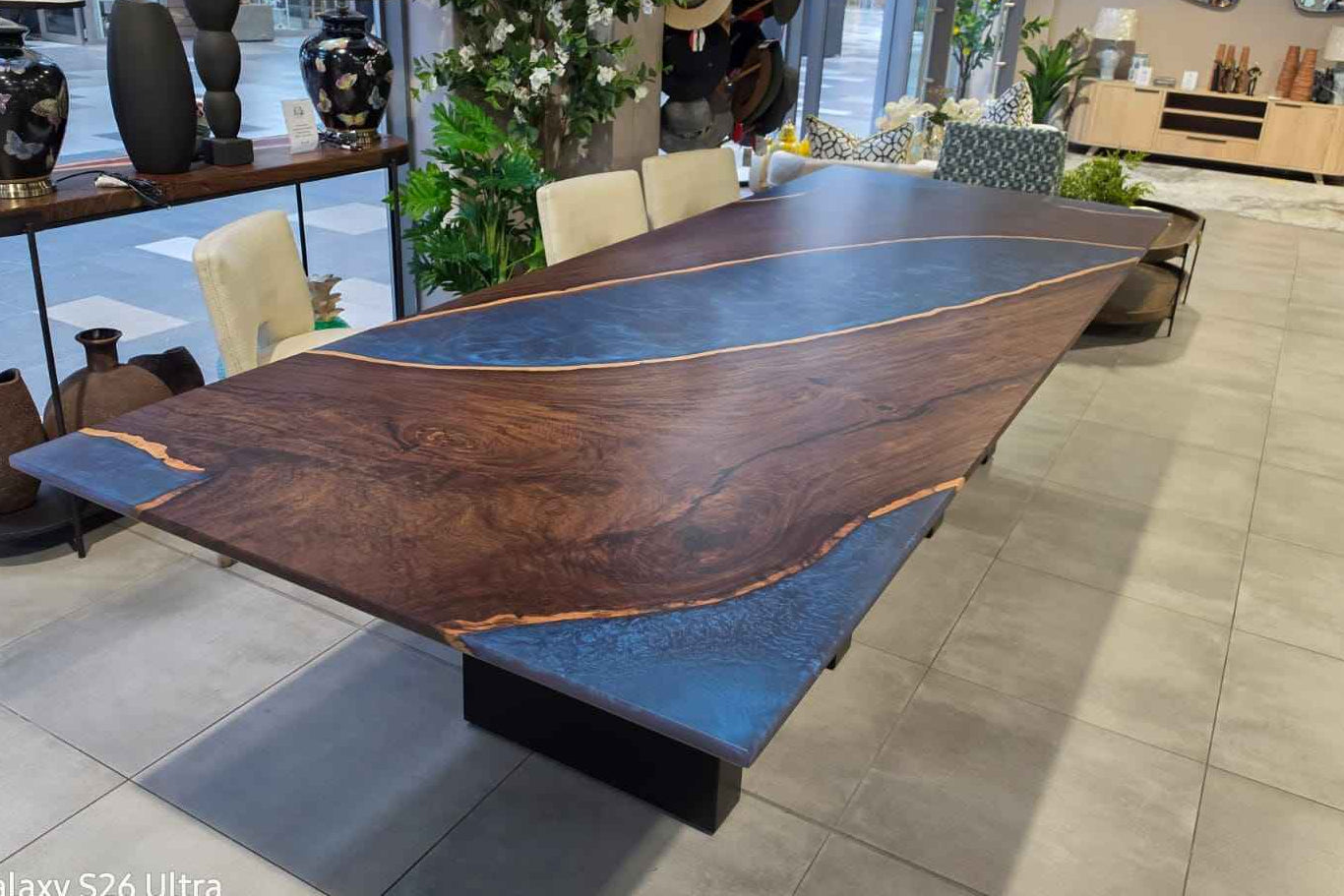 Leadwood table with arched metal legs